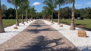 Royal Palms Planted With Alabama Marble and Tennessee Boulder Beds